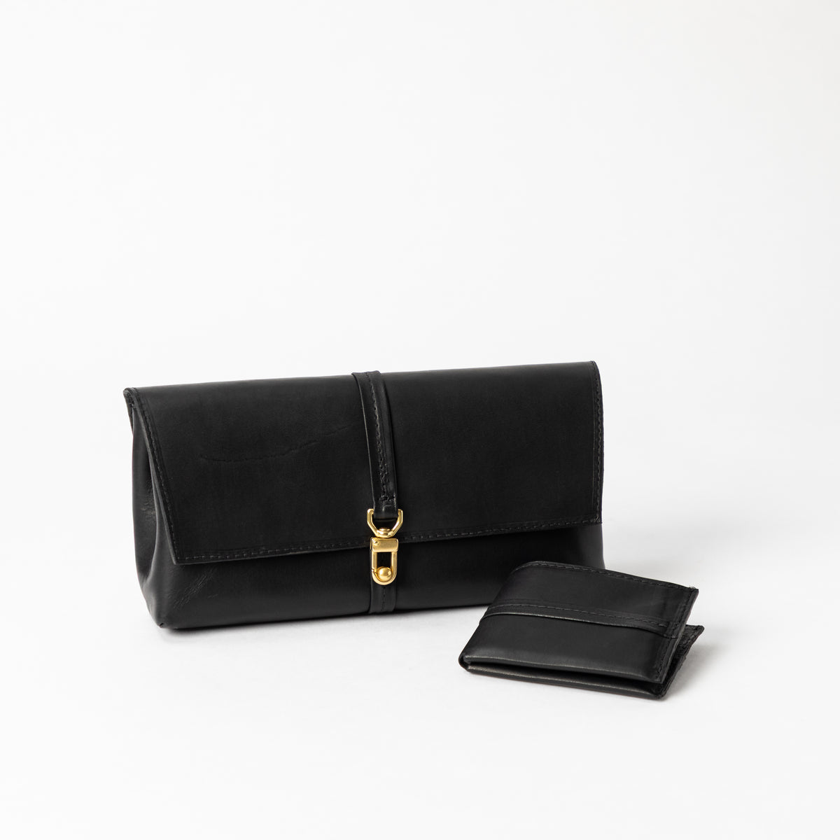 Black Transpose Bag in full-grain vegetable-tanned leather with solid brass clasp and detachable matching wallet